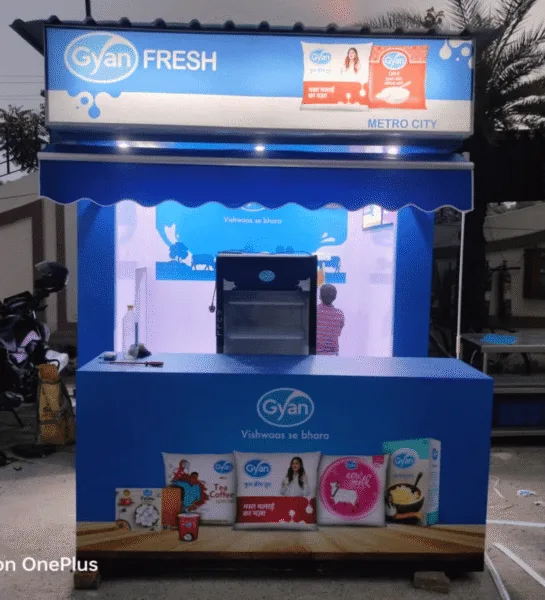 Outdoor advertising agency exhibition stall for Gyan milk and milk products with branding and promotional displays.
