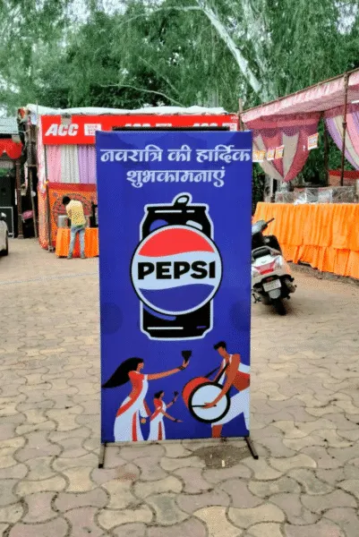 Outdoor advertising agency promotional banner for Pepsi with Navratri festive greetings.