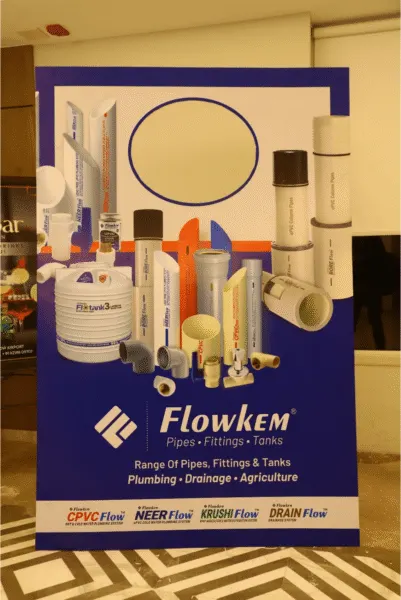 Outdoor advertising agency display stand for Flowkem pipes, fittings, and tanks product promotion.