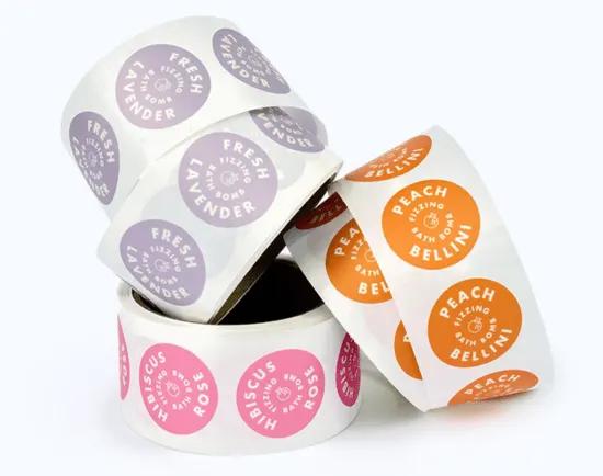 Rolls of custom printed product labels with vibrant colors, representing the best marketing materials for product packaging and brand identity.
